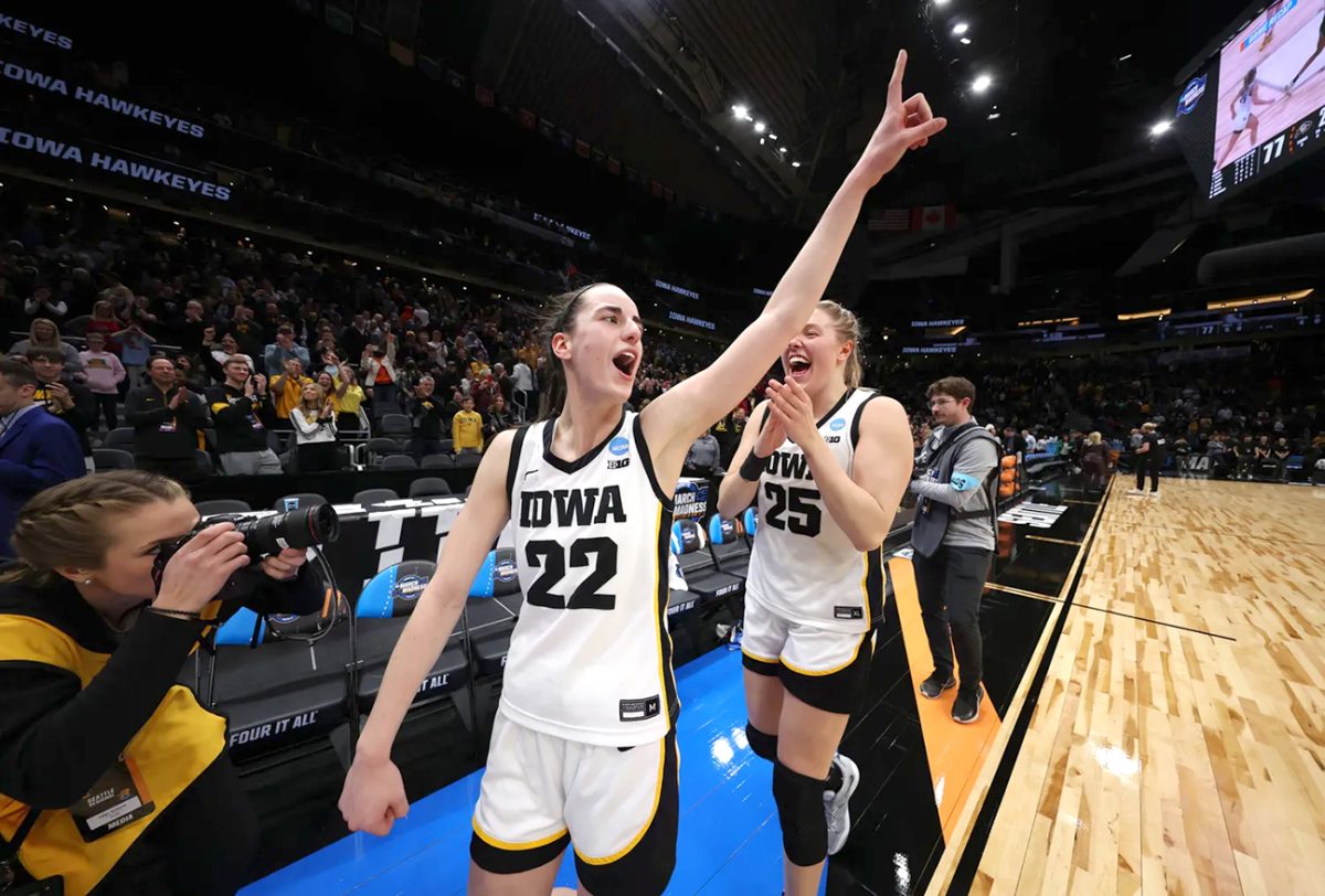 Caitlin Clark (22) and Monika Czinano (25) celebrate their win in the 2023 NCAA Women&#8217;s Basketball Tournament Sweet 16 game against Colorado on Friday, March 24 in Seattle.