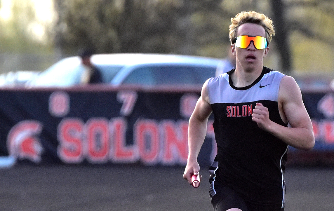 Grant Bumsted runs the anchor leg of the 1,600-meter distance medley relay Tuesday, April 18 in the Denny Gruber Co-Ed Relays. Grant Knipper, Blake Timmons, Michael Yeomans, and Bumsted won the race in 3:38.60