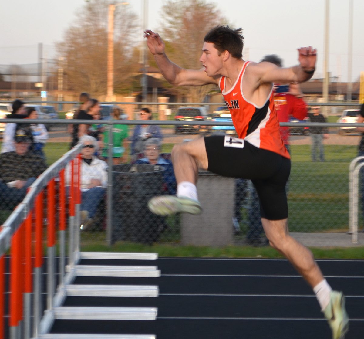 Cole Carney launches toward a hurdle in the 110m High hurdles Thursday, May 4 at West Delaware High School in Manchester during the 2023 WaMaC Meet.