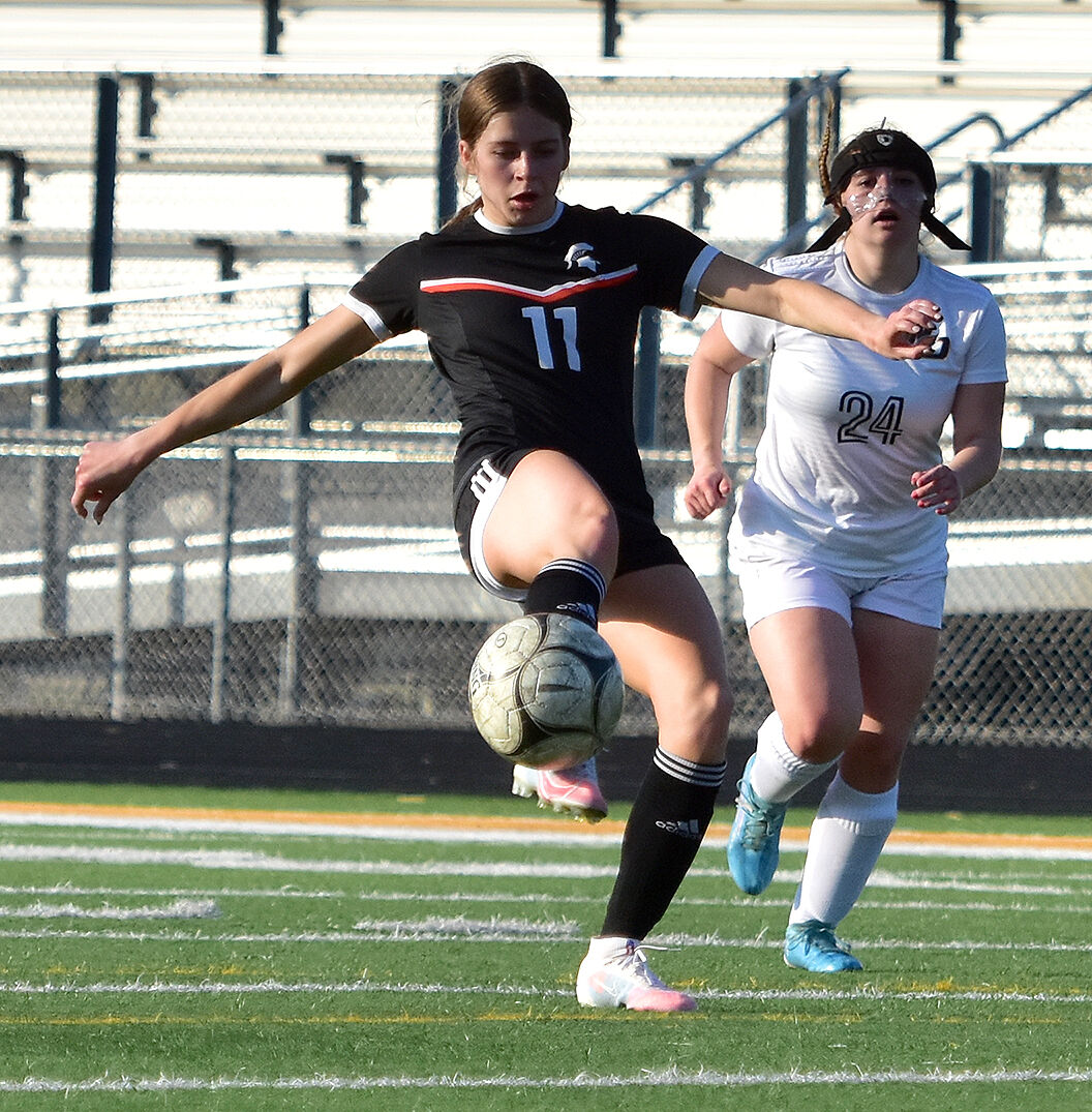 Elena Swan (11) takes a shot at West Delaware’s goal Tuesday, April 25 at home. The Lady Spartans shut out the Hawks 11-0 in the first half.