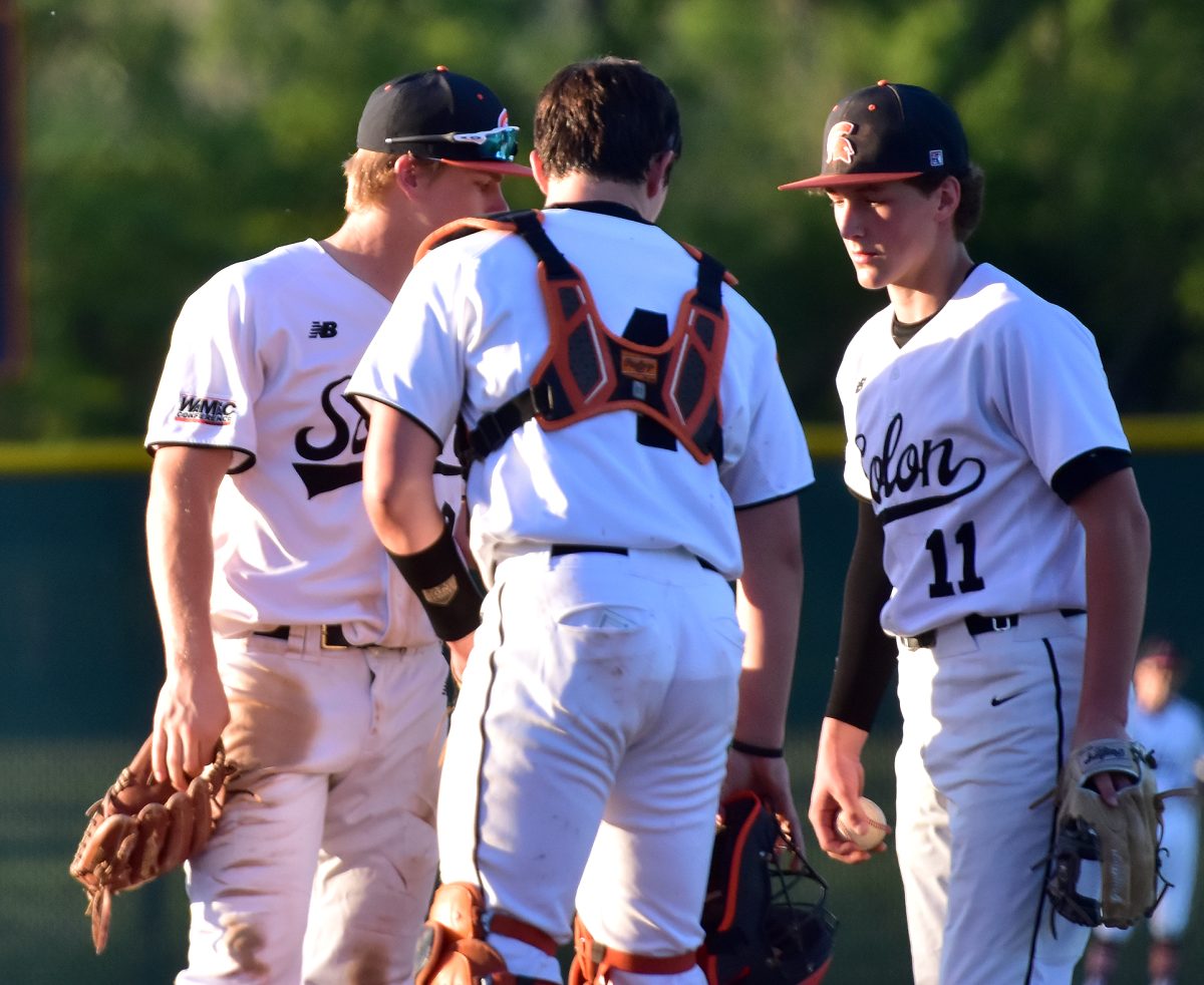 Brett White (28), Gehrig Turner (4), and Vince Steinbrech (11) strategize on how to get out of a tough inning. All three return to Solon&#8217;s lineup this season.