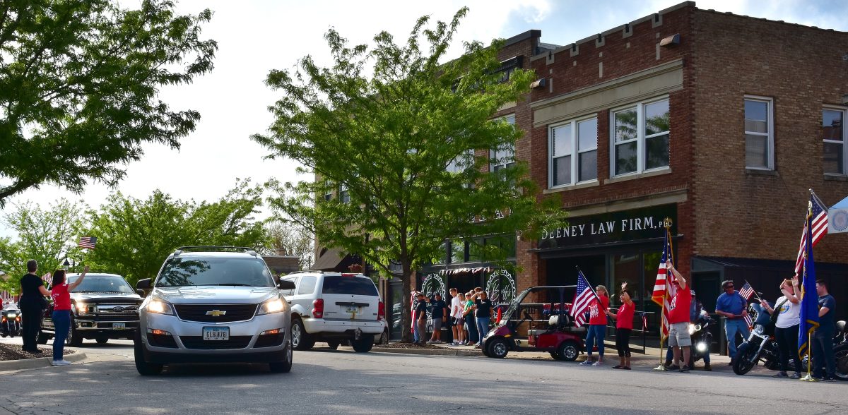 Friends and well-wishers line Main St. as 1st Sgt. Travis Ehlinger and Sgt. 1st Class Cory Wolf come home Friday, May 12 after a ten-month deployment to Poland with the Iowa Army National Guard&#8217;s 209th Medical Company. For more photos, turn to page 20A.