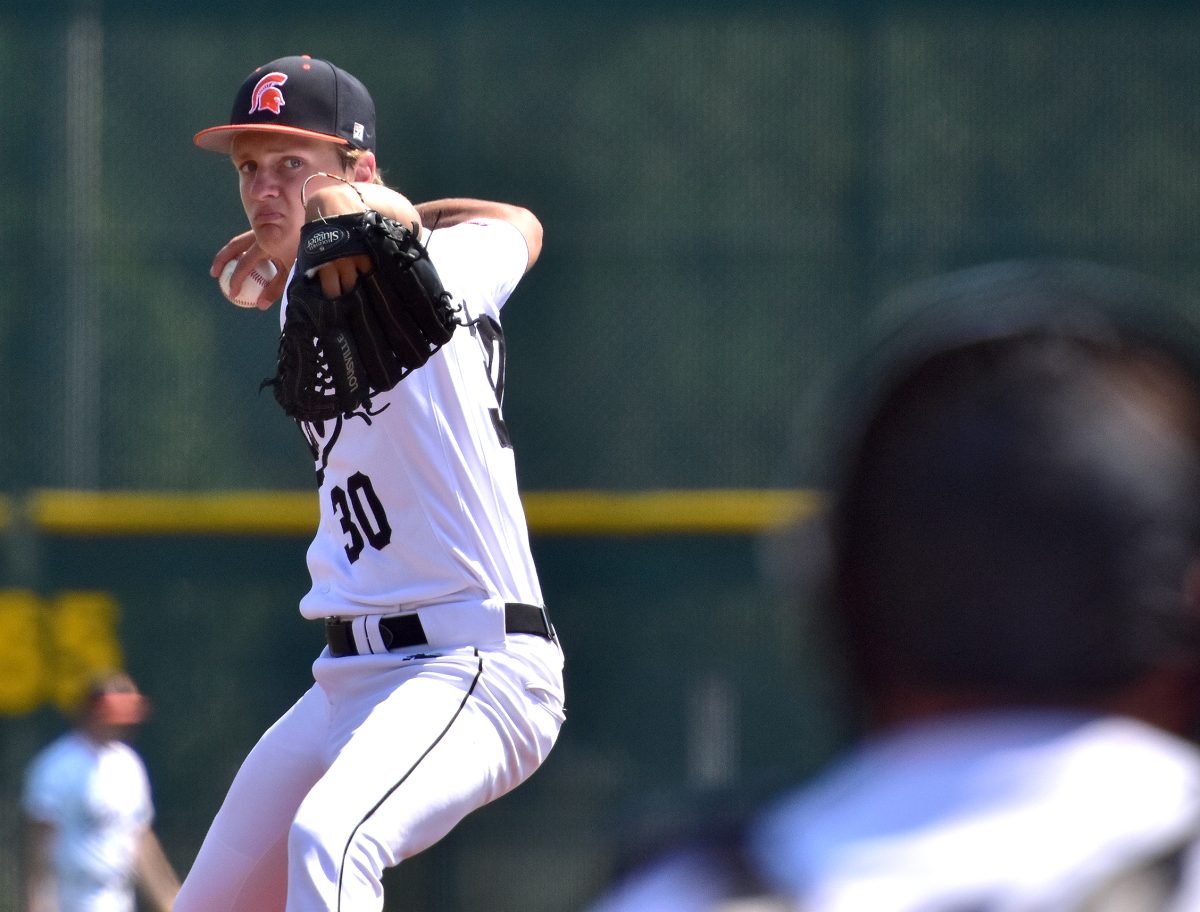 Ty Bell (30) delivers a warm up pitch Saturday, June 3 before starting on the mound against the Iowa City West High Trojans in a non-conference match up.