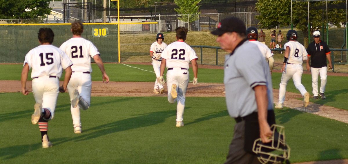 The Spartans race across the field to congratulate Dylan Gorham on his walk off RBI single, that won game one against CPU Thursday, June 22.