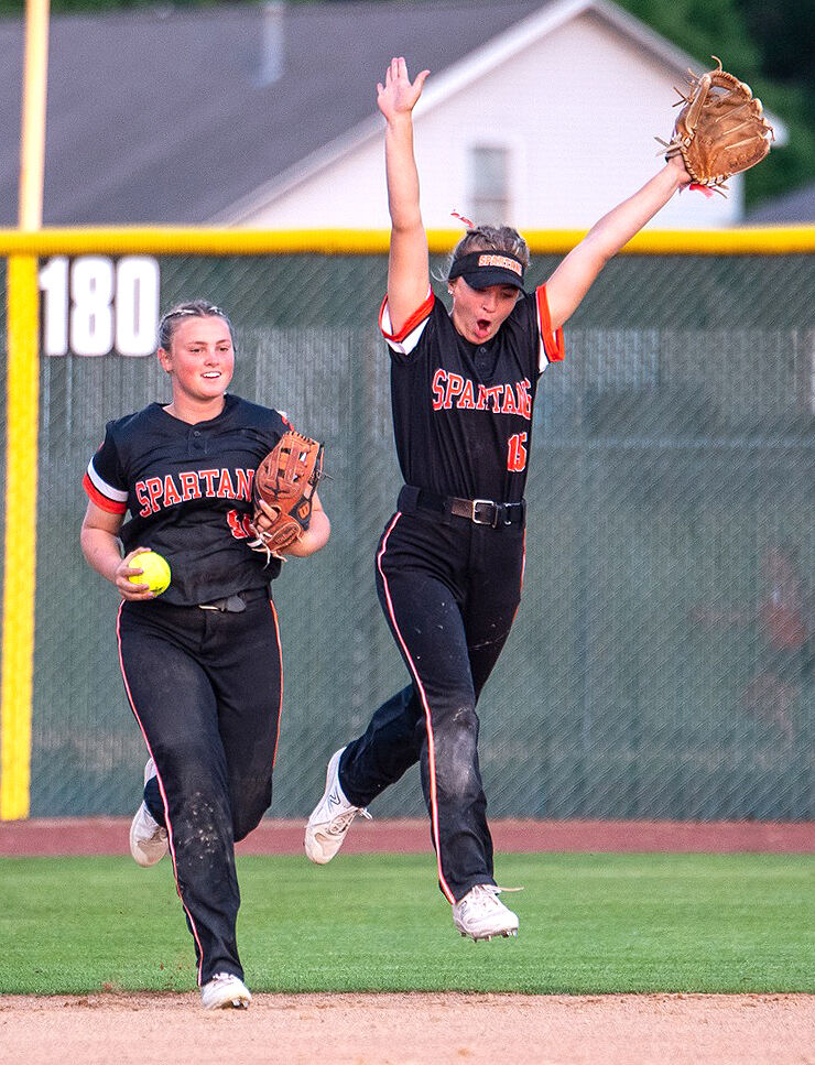 Hilary Wilson (56) and Izzy Frees (15) celebrate a big out in game one of the season opening doubleheader at home against Mount Vernon Monday, May 22. The Lady Spartans split with the Mustangs.