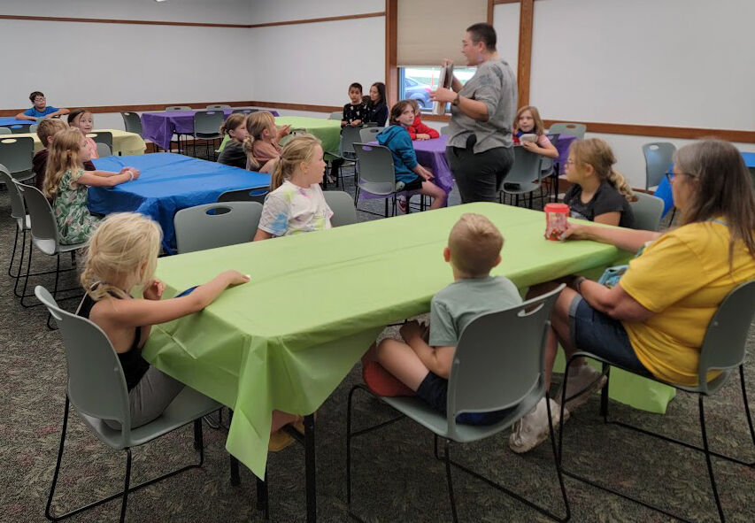 Lily Smith, Youth Services Librarian, shared the books Life Size Zoo by Teruyuki Komiya, and Actual Size by Steve Jenkins with attendees to the BAM POW event Thursday, Sept. 21 at the Solon Public Library. The kids then used modeling clay to make their own colorful creatures.