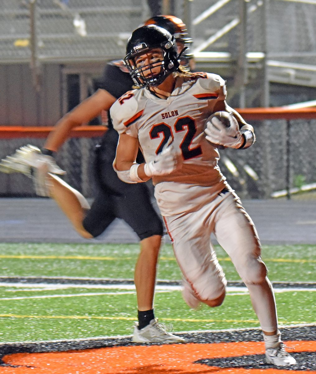 Conlan Poynton (22) scores a touchdown Friday, Sept. 22 at Grinnell. The Spartans opened district play with a 40-7 win over the Tigers and moved to 4-1 on the season.