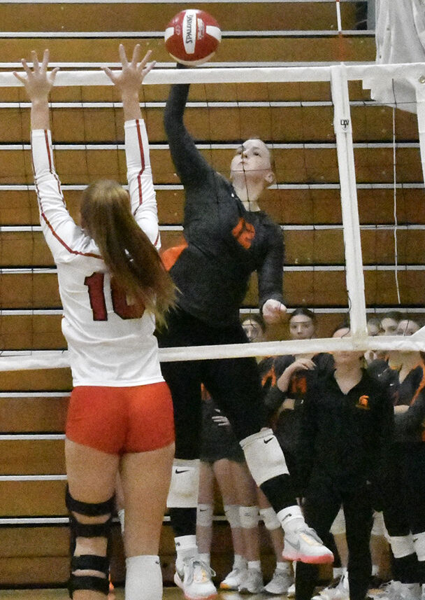 Addie Miller (12) swats the ball in a kill attempt Thursday, October 12 during the WaMaC Conference Tournament at Marion High School.