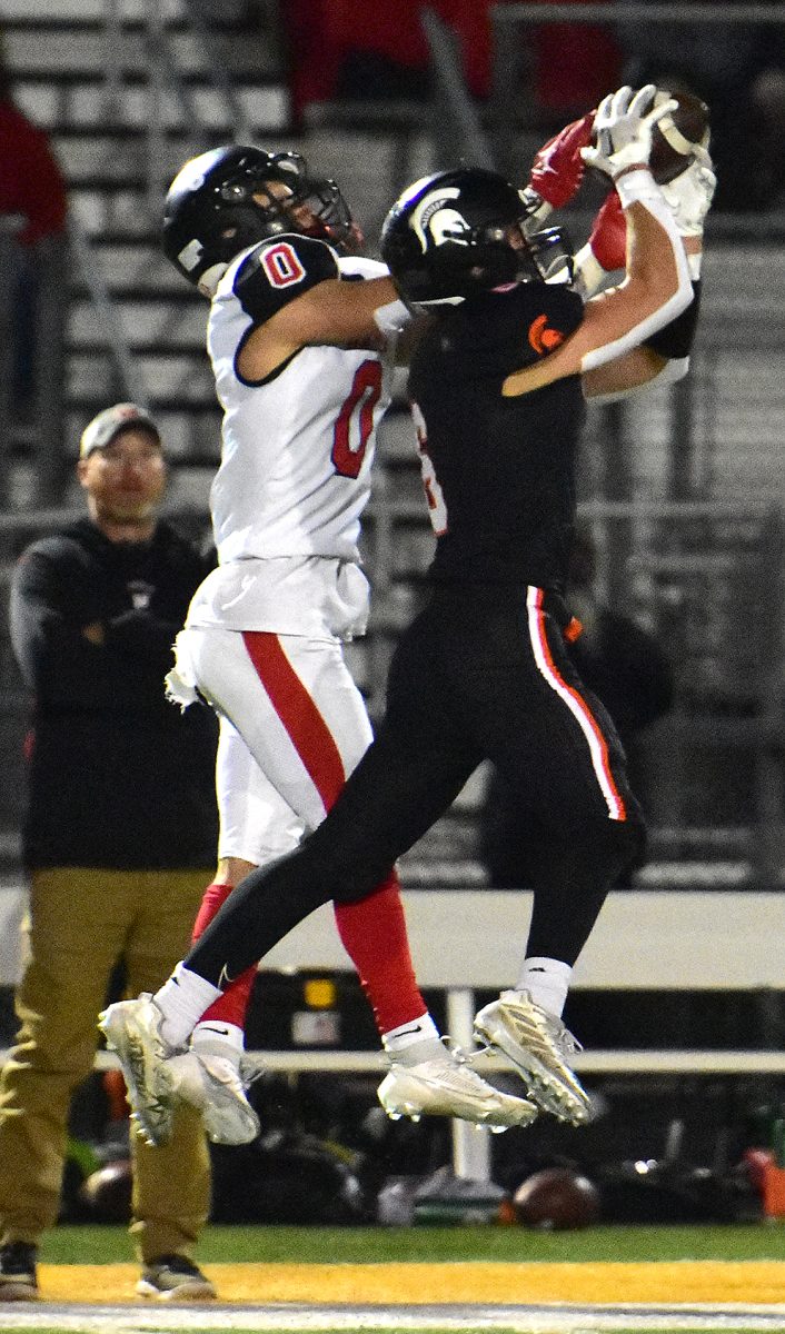 Jack McCarty (6) intercepts a pass intended for Williamsburg&#8217;s Braylon Wetjen (0) Friday, October 6 as the Spartans upset the No.4-ranked (in 3A) Raiders 21-14.