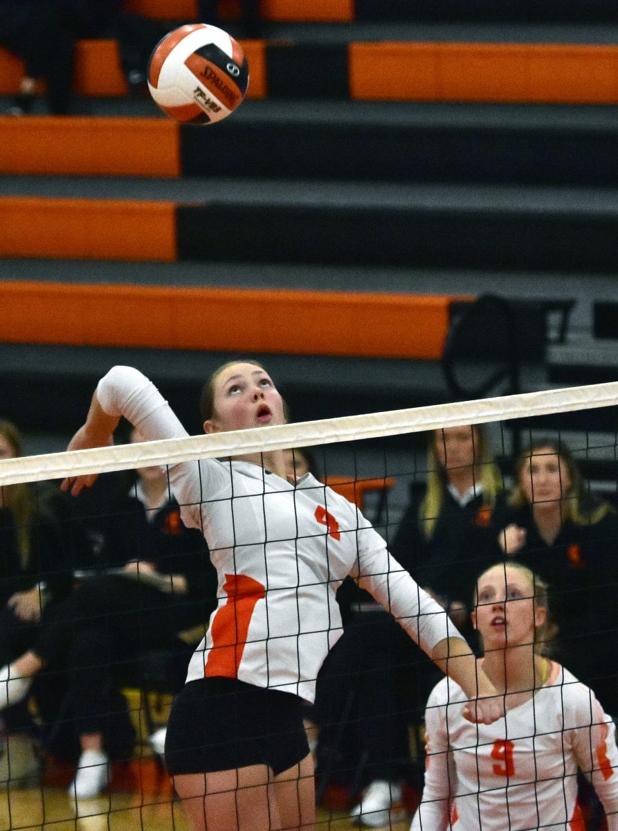 <p>Grace Erwin (4) launches a kill shot Thursday, October 19 at the Tipton Tigers in a Class 3A Region 8 semifinal match. Erwin led Solon with 14 kills, second only to Tipton’s Avary Calonder, who produced 16.</p>