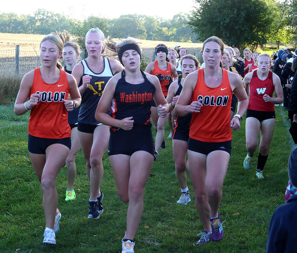 <p>Falyn Svalstad, Gracie Federspiel, and Ava Rowles run Saturday, October 7 at North Linn HS near Troy Mills. Svalstad, a freshman, was 11th in 20:30 with senior Federspiel 13th in 20:34.</p>