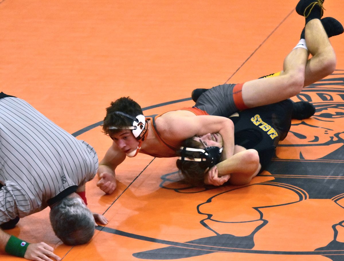 Jordan Schmidt looks for the pin against Midland&#8217;s Shayden Hansen in a 132-pound match Thursday, Feb. 2 in the Solon Duals. Schmidt finished the &#8217;22-&#8217;23 season with a 7th-place showing at the 2023 State Meet.