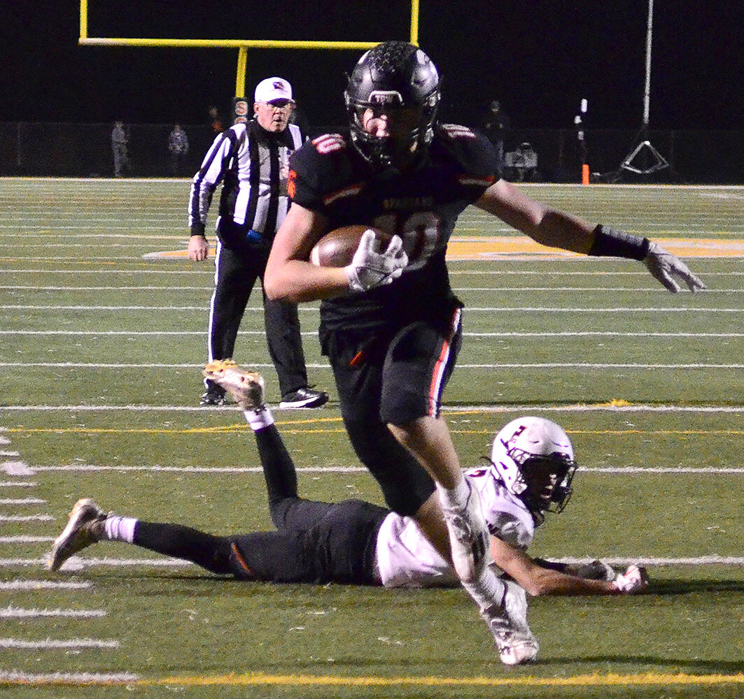 Eddie Johnson (10) escapes a West Delaware player as he dashes to a touchdown Friday, Nov. 3 in a Class 3A Quarterfinal game. Solon’s 36-35 win advanced them to the Semifinals, in the UNI Dome, this Saturday night.