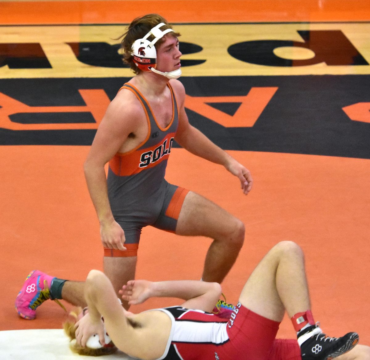 Lawsin Sinnwell gets up after pinning Williamsburg&#8217;s Sawyer Kirby in a varsity 144-pound match Thursday, Dec. 7 at home.