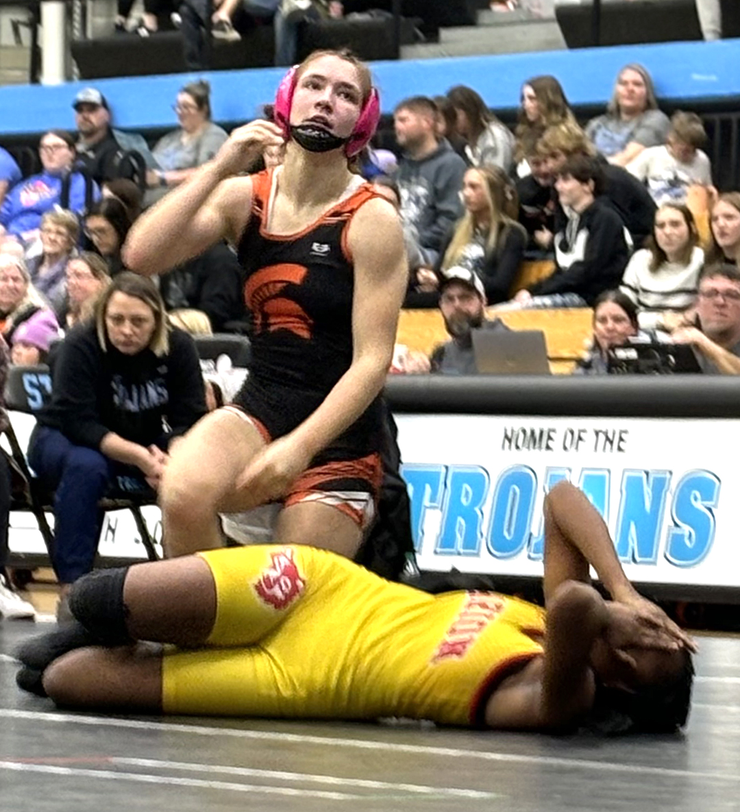 Olivia Bonnema rises after pinning Tarriel White (Marion) in 1:53 last Thursday at South Tama High School. Bonnema was a double winner after pinning South Tama&#8217;s Paisley Bro as well.