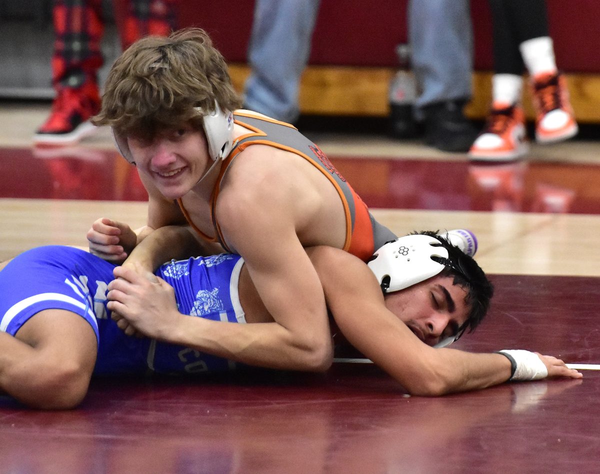 Kyler Steapp smiles as he dominates Columbus&#8217; Ian Estudillo in a Class 2A Regional Dual last Tuesday at Mount Vernon. Steapp won the 120-pound match with a 6-4 decision.