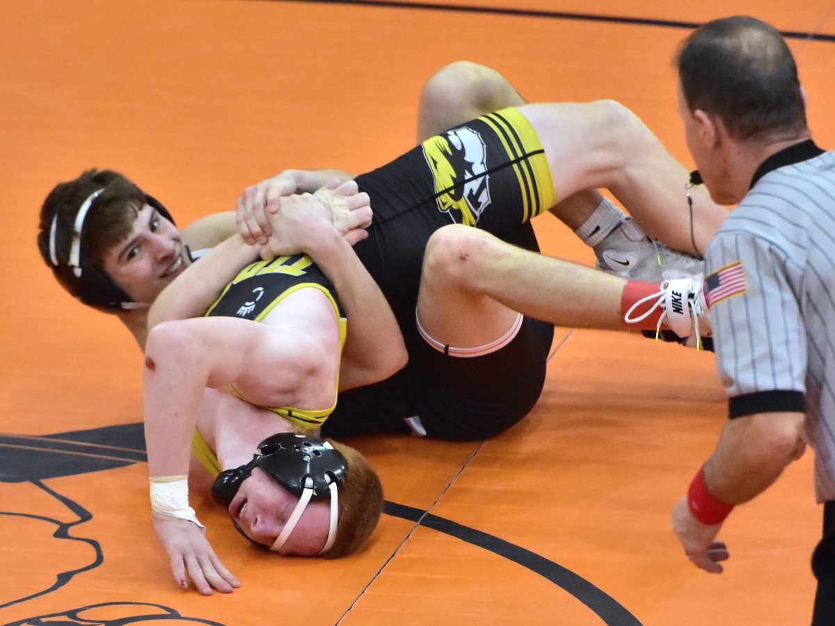 <p>Charlie Karam breaks out a big smile while breaking down Tipton’s Gavin Roth in a 132-pound semifinal match Saturday in the 2A District Meet at home. Karam pinned Roth in 4:00 and finished 2nd to advance to this week’s State Tournament.</p>