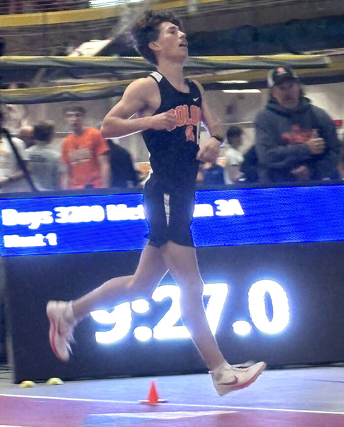 Brick Kabela peels off the track after taking 19 seconds off his 3200-meter school record.