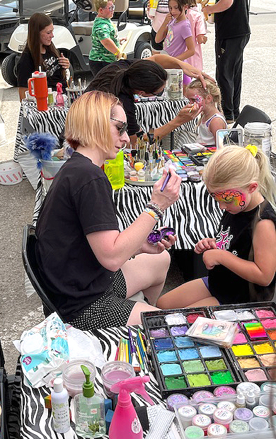 Artists with Funny Faces by Lori work their makeup magic Saturday afternoon in the Solon Beef Days’ Kids Corner.
Deanna Kleinsmith/Submitted photo