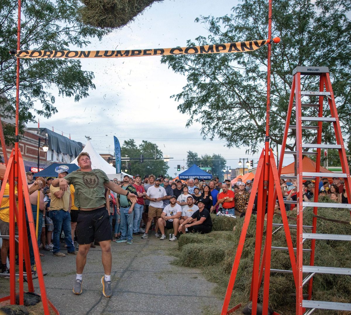 Kade Pieper throws the hay bale well over the bar during the contest. Pieper won the hay bale toss at the 2024 Beef Days, topping out at 12 feet. Pieper wanted to chase down the record held by his Hawkeye football teammate, Gennings Dunker, but fell a few throws short. “I think the bales were lighter last year, they were pretty green and heavy this year.”