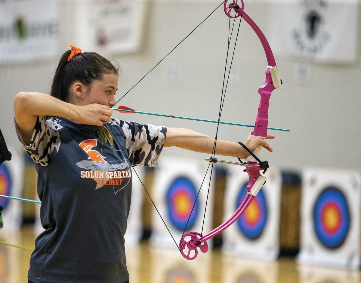 Miranda Simison shoots and arrow during the second annual Beef Days Archery Tournament. Simison is a member of the Solon Spartan Archery Team. Solon archery head coach Steve Madura said, “This event benefits the team because we are able to have our archers shoot in the summer when it’s the off-season. And we are reaching out to the community and letting them see what our organization is about.”