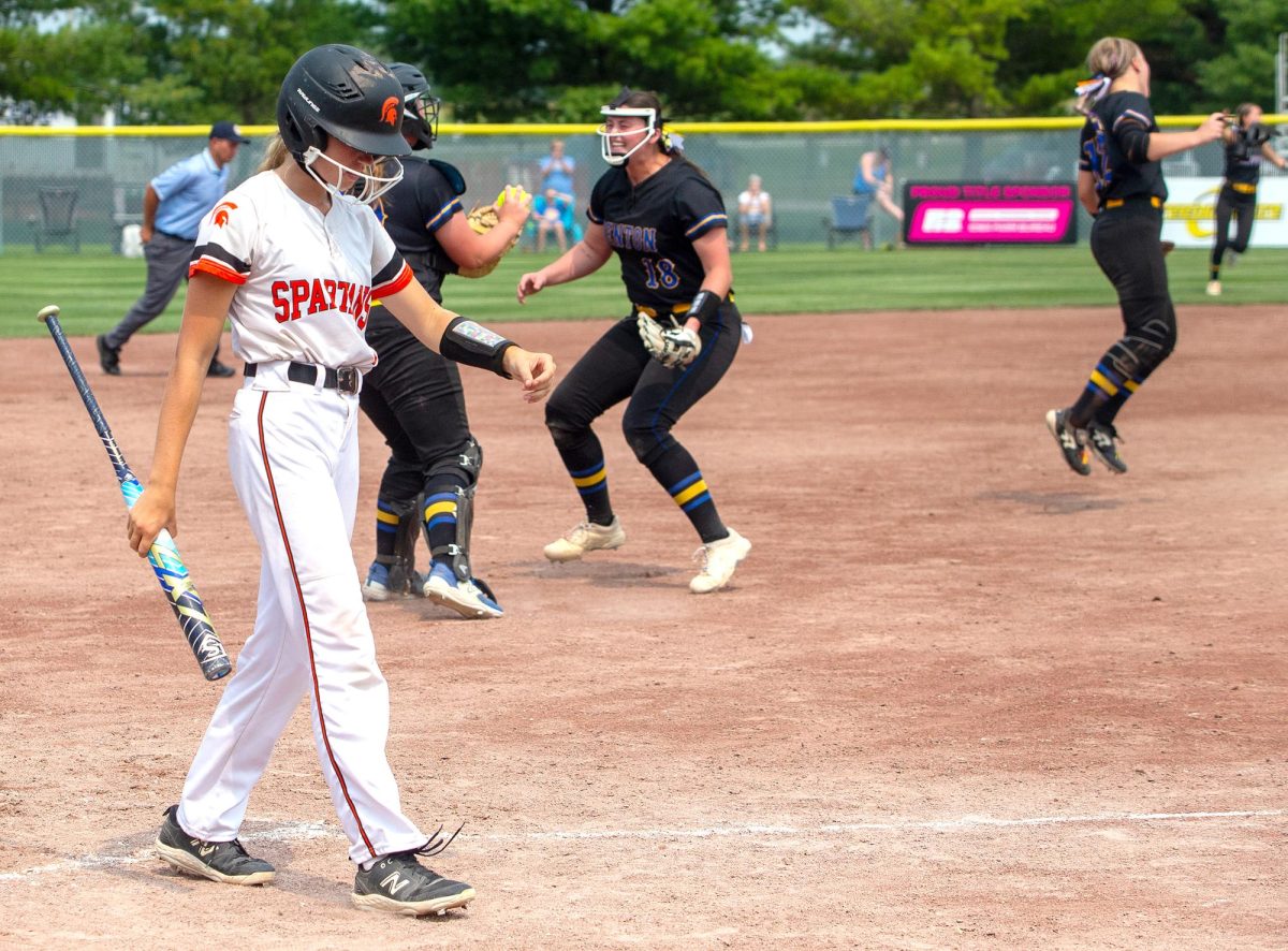 Avery Babbit walks back to her teammates after striking out to end the game. The Lady Spartans could not get themselves out of the four run hole they were in after the first inning as they fell 5-1 to Benton Community last Tuesday in the quarterfinals of the 3A State Softball Tournament in Fort Dodge.