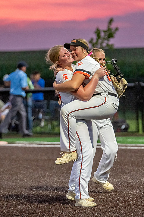 Emerson Miller jumped into Kendall Jensen’s arms to celebrate an 11-1 win over No.11-ranked West Liberty this past Saturday in a 3A Region 6 semifinal game at West Liberty.