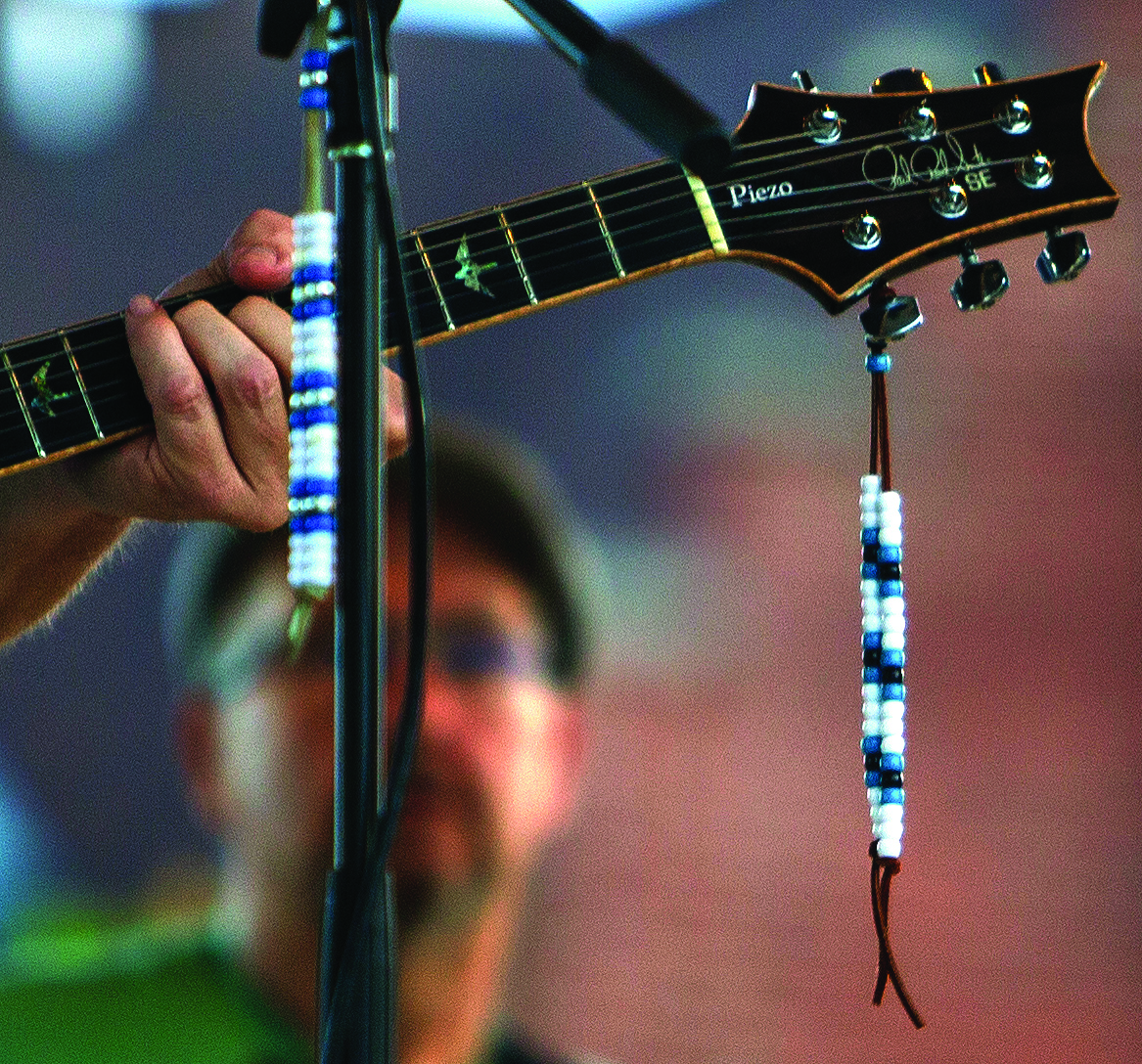 Allen ties these beads to his guitar and mic for every show he performs. Allen uses the beads to honor his longtime friend he shared the stage with many times, Stevie G.