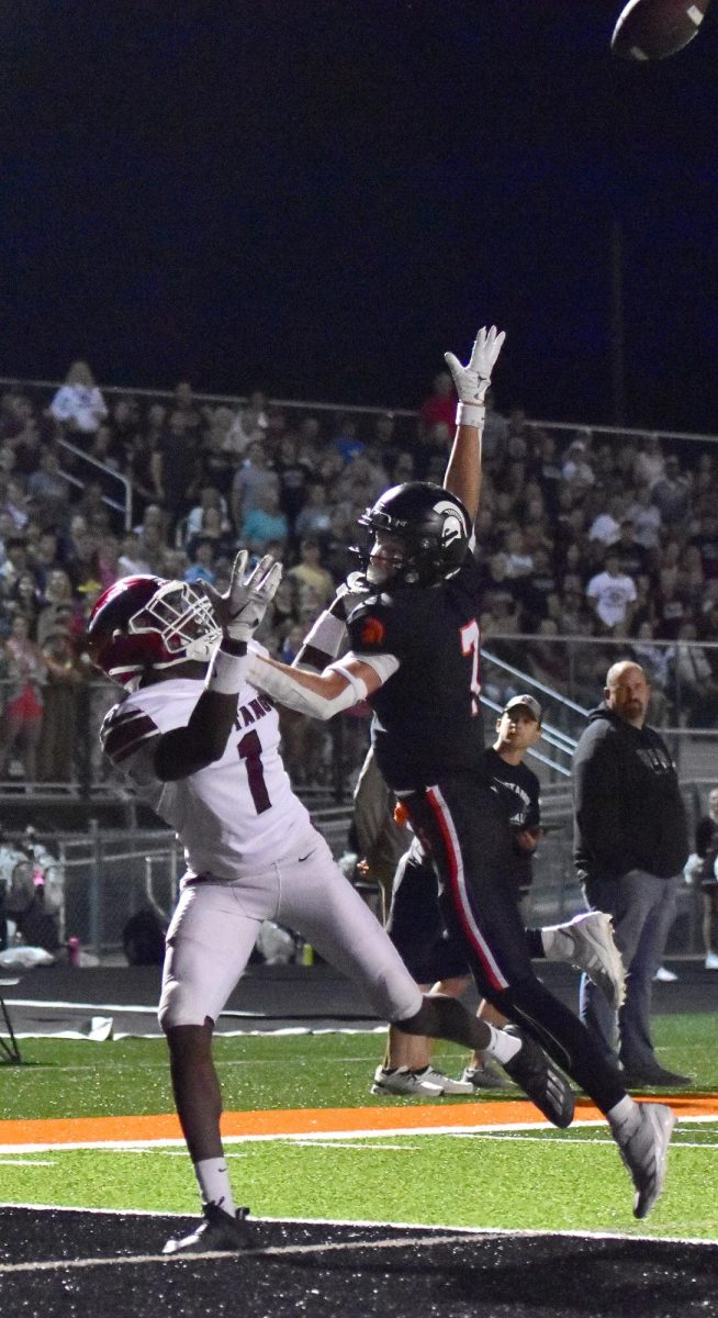 Eli Kampman (7) attempts to break up a pass intended for Mount Vernon’s Watson Krob (1) this past Friday at home on Armed Forces Night. The Spartans held off their archrivals for a 7-6 win to remain undefeated at 4-0 on the season ahead of the start of district play this week.