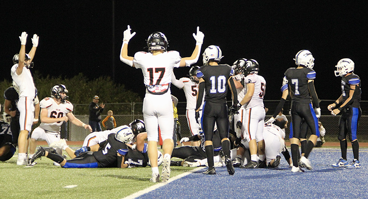 The Spartans celebrate an Eddie Johnson (10) touchdown Friday, Sept. 6 at Clear Creek Amana in Tiffin. Johnson, a senior, scored five touchdowns in a 42-14 win over the rival Clippers.