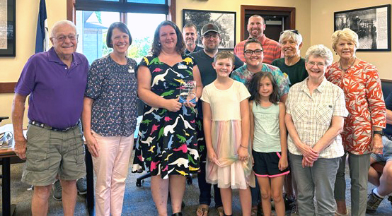 At the September 4, 2024, City Council Meeting, Alexis Kurth was recognized for her five years of service to the Solon Public Library. (First row, from the left: Paul Saupe, Liz King, Alexis Kurth, PJ Kurth, Harper Kurth, Kris Brown. Second row, from the left: Taney Kurth, Lily Smith, Janet Salathiel, Sandy Lawrence. Third row, from the left: Bob King, Mayor Dan O’Neil.