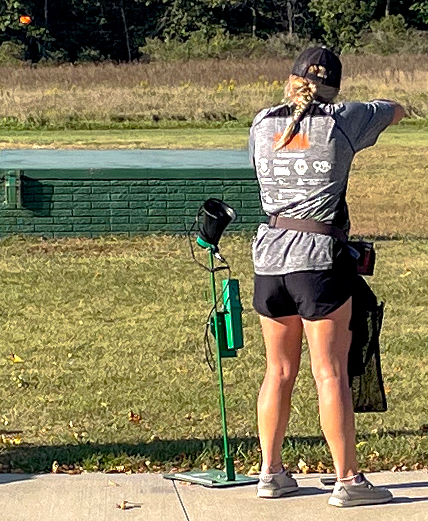 Allen Shima (left) and Kacey Craig (right) set up for their shots during trapshooting practice.