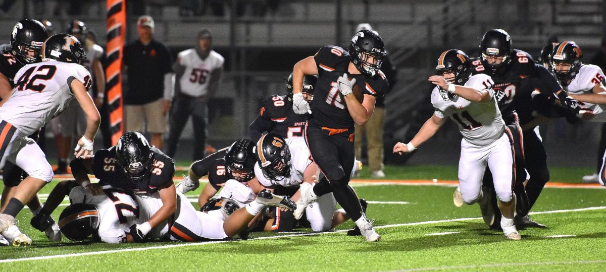 With Lucas Feuerbach (72, at left), Grant Wilson (55), Teague Williams (16), Owen Grimm (50), and Jackson Feuerbach (60) doing their jobs, it’s smooth sailing for Eddie Johnson (10) as he scampers downfield against Fairfield on Senior Night. Johnson, a senior, scored three touchdowns including a 95-yard dash to score.