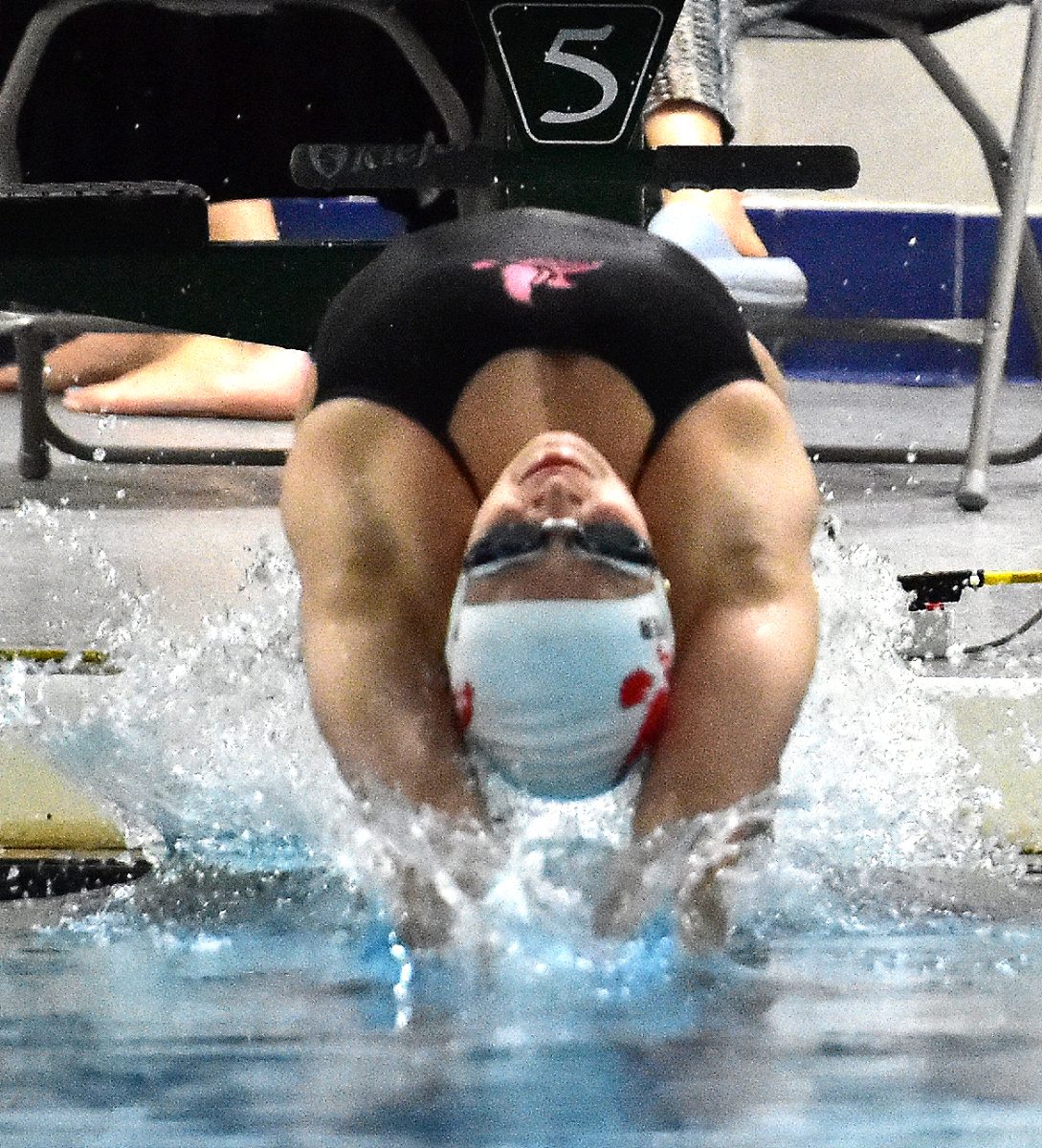 Solon senior Grace Hoeper won the 
varsity 100-yard backstroke last Tuesday as Iowa City High met Iowa City West High/Liberty High in the annual crosstown rivalry meet. Hoeper
also won the 50-yard freestyle.