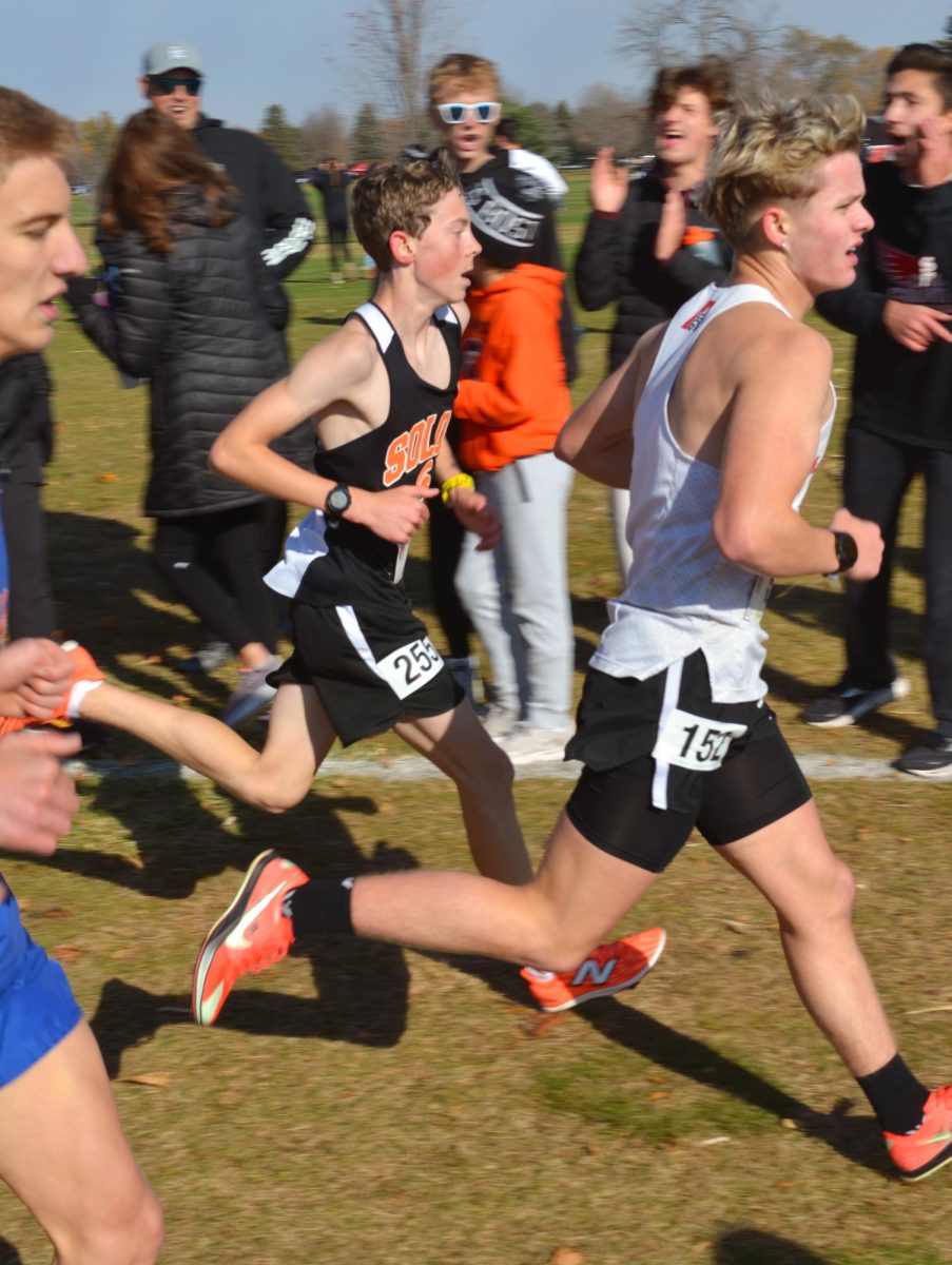 Solon freshman Anders Holmes charges through the field in the 2024 Class 3A State Championship race Friday, Nov. 1 in Fort Dodge. Holmes finished in 49th place in 17:07.