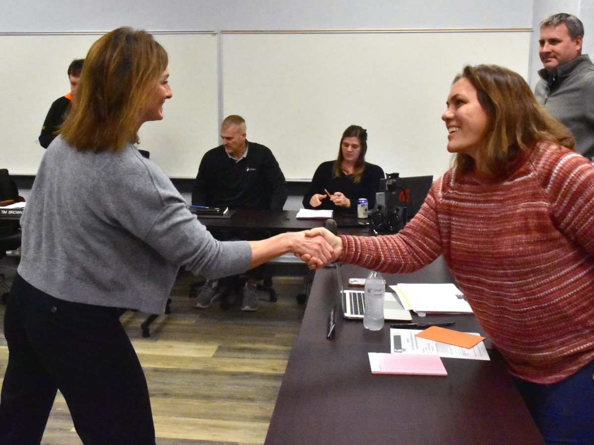 Board Member Cassie Rochholz (at right) congratulates Megan Laing on her appointment to the Solon Community School District Board of Directors. Laing was approved by the Board on a 4-0 vote Monday night to fill the vacancy created when Jami Wolf resigned due to moving out of the district.