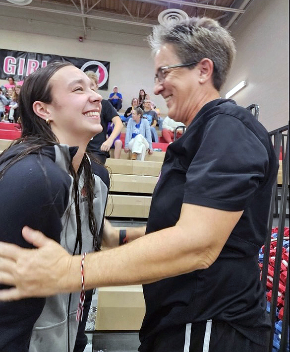 Grace Hoeper and City High swimming and diving coach
Mandi Kowal share a moment of celebration at the 2024 Girls State Swimming and Diving Meet in Marshalltown this past weekend. Hoeper, a senior, won both the 50 and 100-yard freestyle events to bring her State Championship total to five.