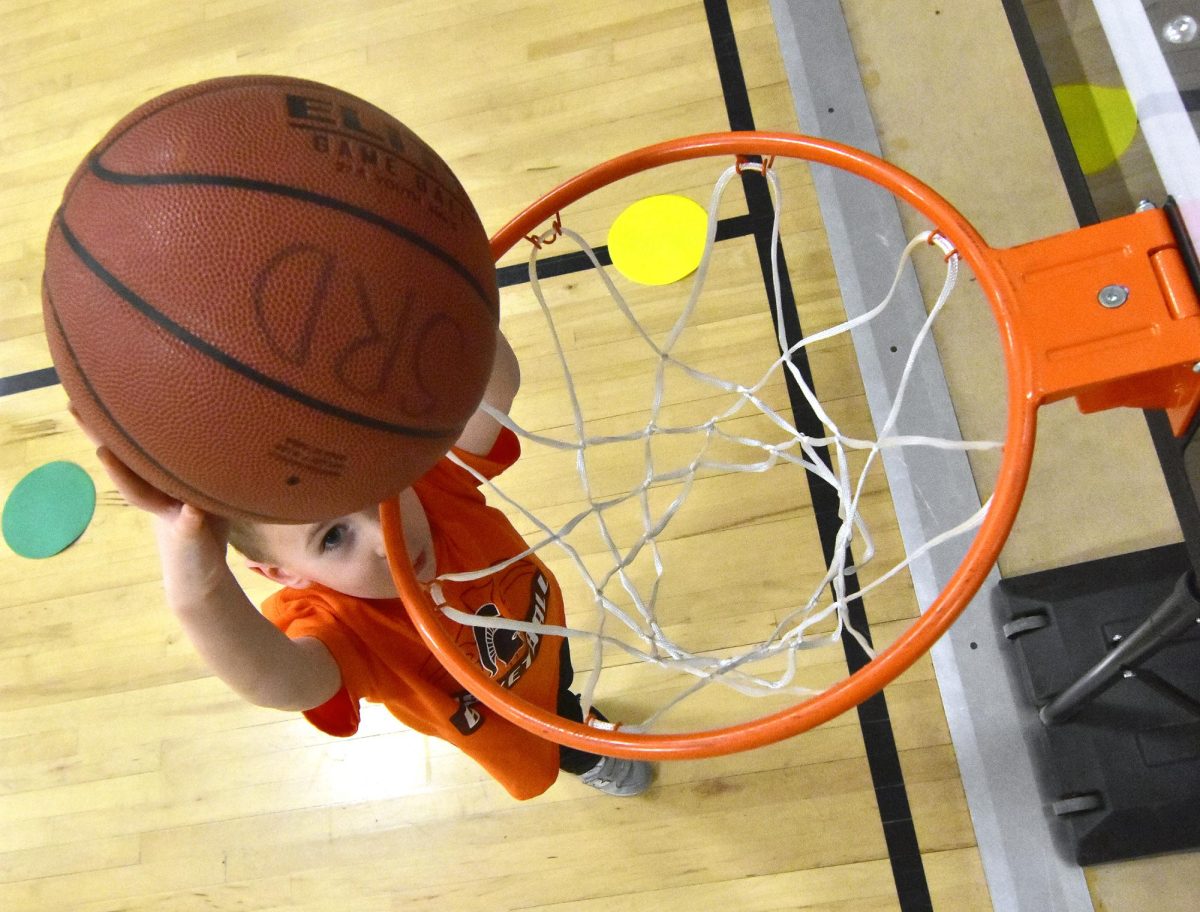 Hugh makes a slam dunk during an adaptive basketball session Wednesday, Dec. 11 at the Solon Community Center. Adaptive sports programming is becoming more popular in Solon and makes it possible for children with a variety of challenges to enjoy sports activities.