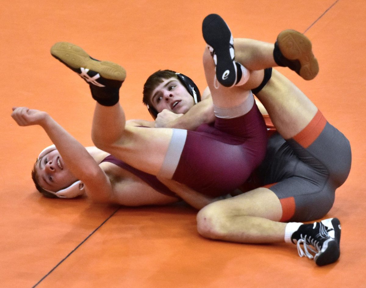 Charlie Karam goes for the pin against Mount Vernon’s Chasen Caskey in the 138-pound match Thursday, Jan. 23 at home. Karam won by technical fall, 16-0, in 4:03.