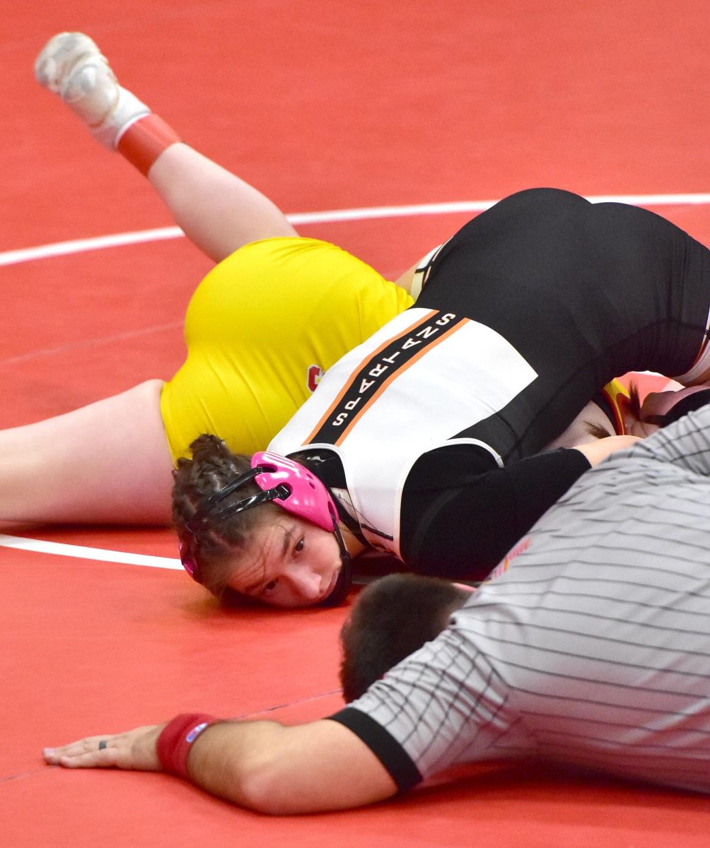 Olivia Bonnema looks for the pin in a 145 pound match against Marion’s Kaelynne Blood Thursday, Jan. 9 at Marion HS. Bonnema pinned Blood in 30 seconds to go 2-0 on the night.