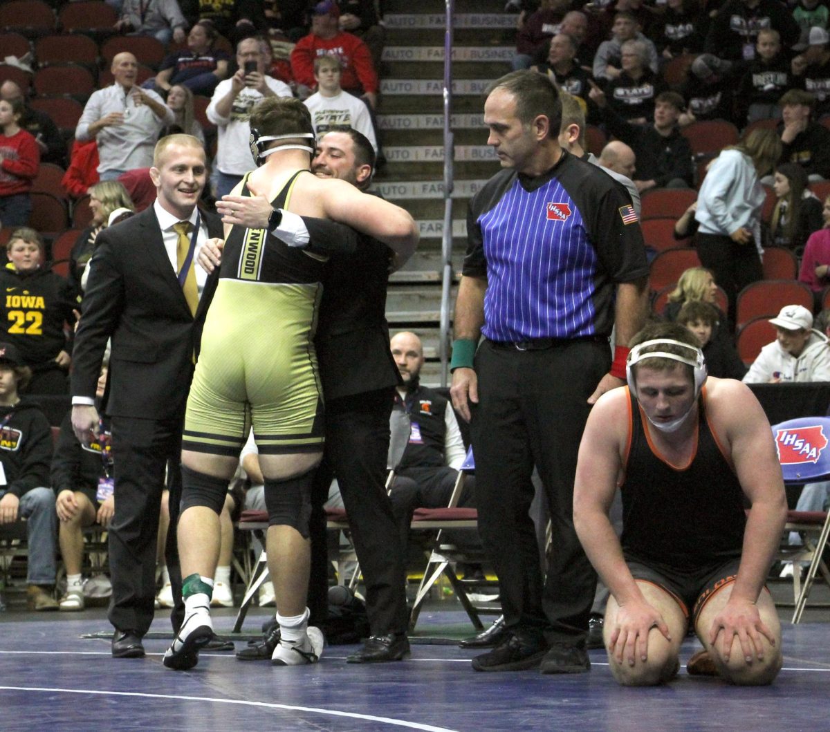 Solon’s Lucas Feuerbach reacts to his defeat as Glenwood’s Mason Koehler celebrates winning the 215-pound State Championship match Saturday night in the finals of the 2025 State Wrestling Tournament at Wells Fargo Arena in Des Moines. Koehler took a 7-0 decision from Feuerbach, a sophomore and now two-time state qualifier. 