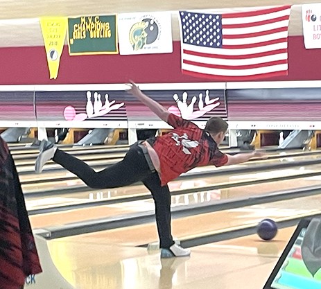 Solon high school senior Carson Reid throws a bowling ball during a competition between Iowa City City High School and Xavier High School. Reid and junior Trendon Walker compete for City High as Solon does not have a bowling team.