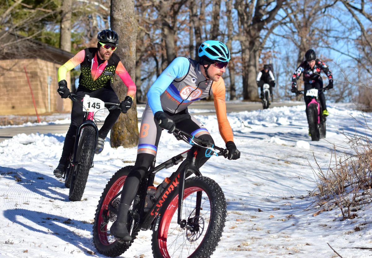 Brian West (145), and Brian Bierman (155) negotiate a sharp and steep downhill turn during the sixth annual Fat Tire Classic bike race at Lake Macbride State Park Saturday, Feb. 11, 2023. This year’s event, raising money for the Solon Centennial Lions Club, will be held Saturday morning starting at the Lake Macbride Golf Course and winding through and around Lake Macbride State Park.