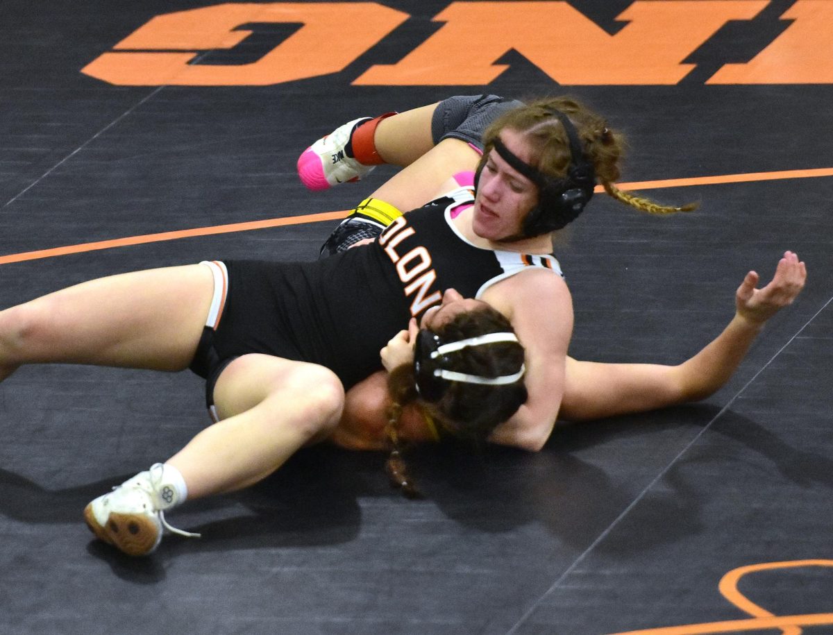 Lucy Miller battles Mid-Prairie’s Emmerson Moore in a 135-pound semifinal match Friday, Jan. 31, in a Class 1A Regional Tournament in Solon. Miller pinned Moore in 4:37.