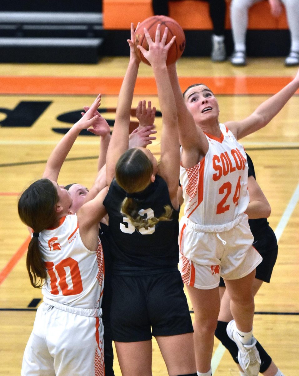 Jerzey Haluska (24) battles for a rebound as CPU Stormin’ Pointers and Quinn Armentrout (10) join in the fray Tuesday, Jan. 28 at home. The Pointers outlasted the Spartans 57-53 (with ten points from Haluska) to improve to 11-5 on the season while dropping the Lady Spartans to 8-8.