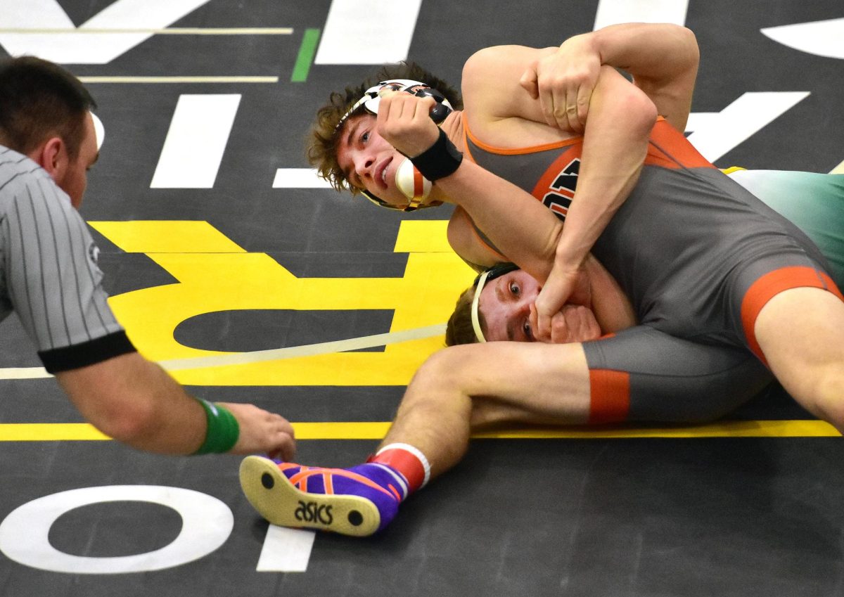 Jordan Schmidt tries to pin Beckman Catholic’s Shawn Brunsman in the 144-pound match Thursday, Jan. 30. Schmidt settled for a 16-1 technical fall in 5:37 as the Spartans dominated the Blazers 74-4 in a night of dual meets.