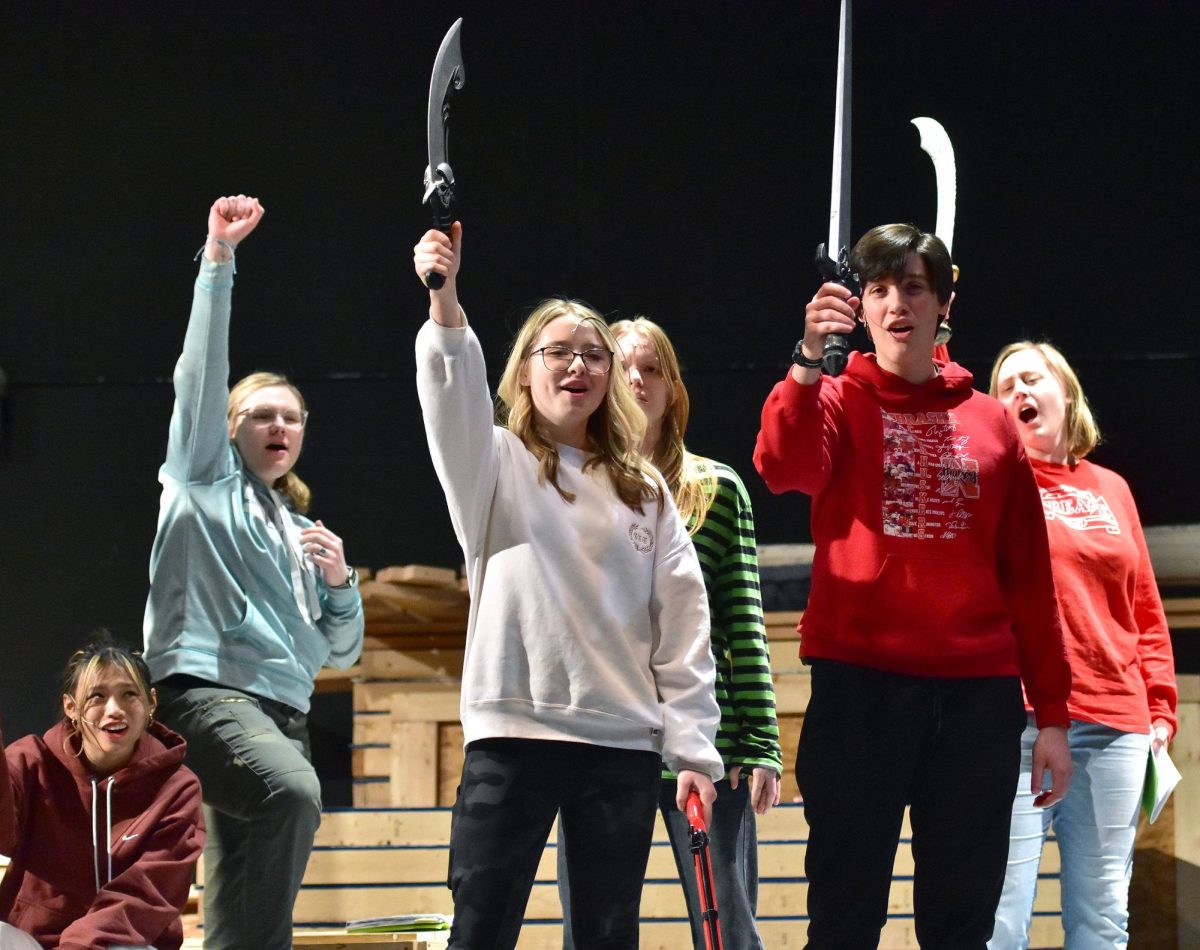 (From left) Jadlyn Huynh (Agnes/Pirate 1), Abby Kramer (Pirate), Merrick Gravert (Morgan Bluebeard), Evann Freerks (Princess Maria), Natalie Arthur (Jackie Bluebeard), and MacKenna Kramer (Pirate) rehearse a scene from The Pirate Sisters and the Bounty for Bluebeard, this year’s spring play at Solon High School. The curtain goes up Saturday, March 8 and Sunday, March 9 in the Center for the Arts.