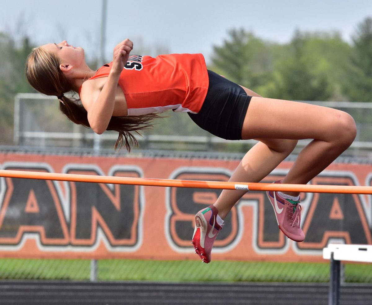 Layla Shipley sails over the bar in the early stages of the high jump Tuesday, April 22, in Solon’s Denny Gruber Co-Ed Relays. Shipley paced fifth in a three-way tie at 4’-8”.