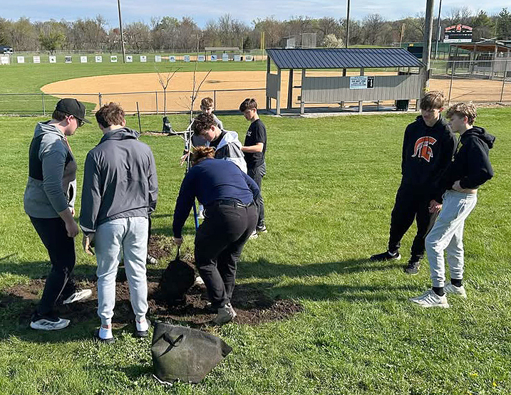 Solon High School students teamed up with city employees to plant trees at the SRNA Tuesday, April 22, in recognition of Earth Day and to replace trees lost to the August 2020 derecho. (Scott Kleppe / contributed)