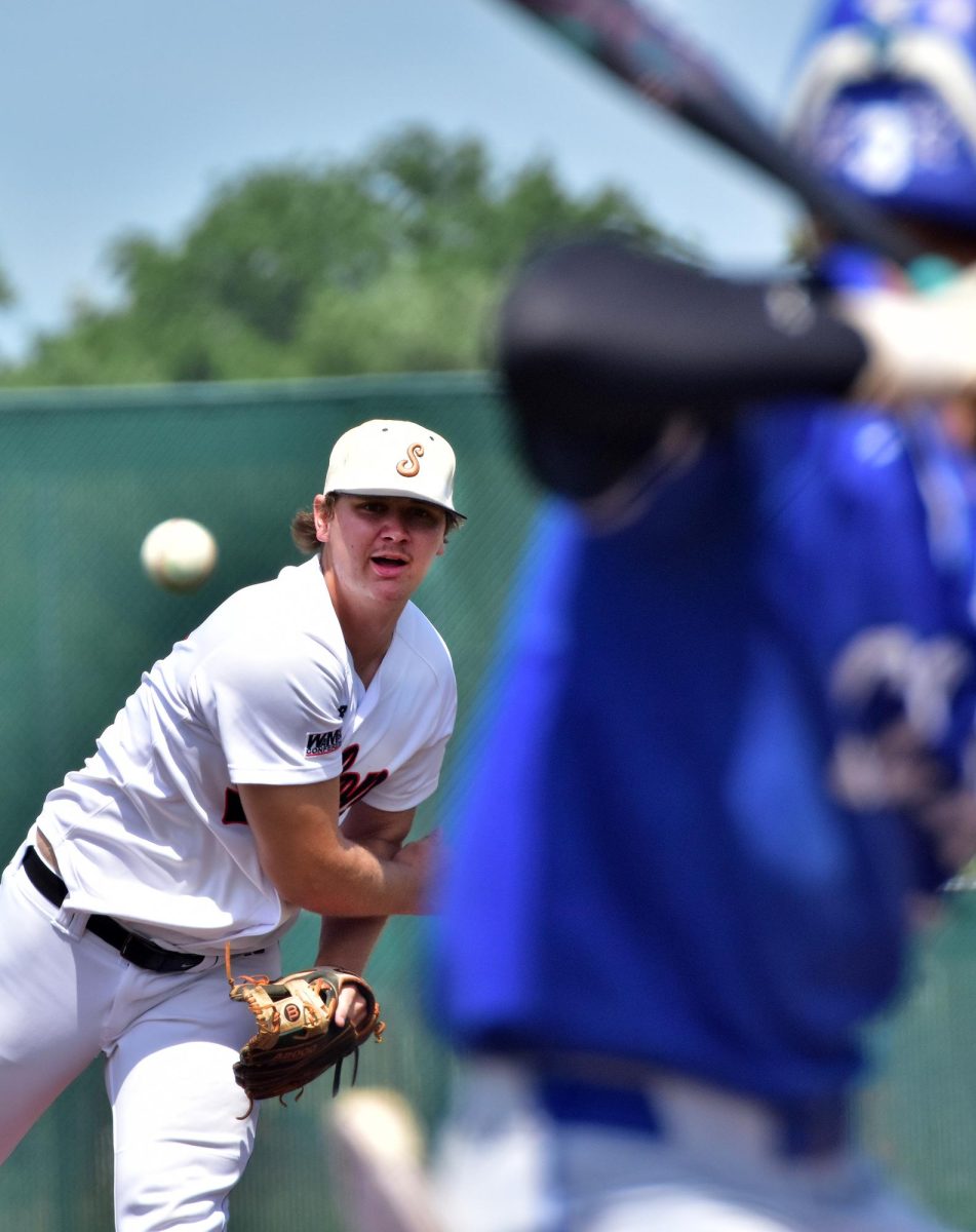 Senior Jackson Link delivers a pitch in the first inning of game one of a varsity doubleheader against WaMaC West rival Clear Creek Amana Thursday, July 3 at home. The Spartans split with the Clippers 9-19 and 6-3.